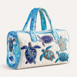 Turtle Charm Quilted Duffle Bag